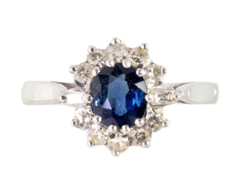 A SAPPHIRE AND DIAMOND CLUSTER RING  in white gold, marked 18ct, 3.5g, size K ++Satisfactory second hand condition