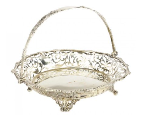 A VICTORIAN PIERCED SILVER ROUND CAKE BASKET  with gadrooned rim, pierced handle and feet, 22cm diam, by Josiah Williams & Co