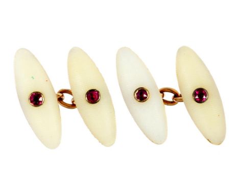 A PAIR OF RUBY, CARVED WHITE STONE AND GOLD TORPEDO CUFFLINKS 2cm, unmarked, 7.4g ++Stylish cuff links in satisfactory second