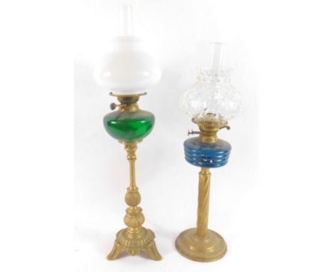 A brass oil lamp, with a green glass reservoir, glass chimney and white glass shade, 18.5cm high, and a brass oil lamp, with 