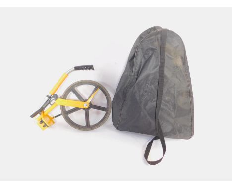 A Trumeter road measurer, 5000-611, serial no 548824, bagged, together with a Step Ahead high visibility jacket. (2)