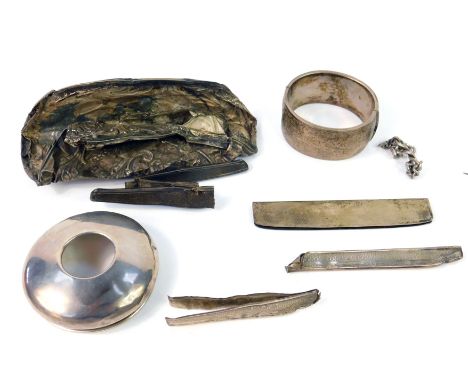 A group of scrap silver, including a dressing table jar lid, and a bangle, 5.63oz.