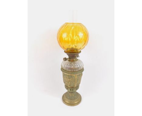 A Hink's Benetfinx &amp; Company No 2 duplex oil lamp, with a brass base embossed with winged figures, flowers and leaves, fl