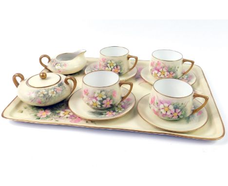 A Rosenthal and Limoges composite porcelain Cabaret set, early 20thC, outside decorated with flowers, comprising four coffee 