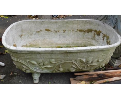 A faux marble garden trough, with leaf moulding, plastic, of oval form raised on four feet, 48cm H, 111cm L, 62cm D.