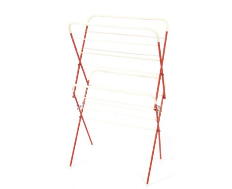 A vintage 20thC red metal and white plastic clothes airer. 110cm H, 39.5cm W, 38cm D.