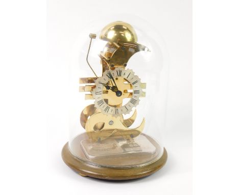 A Heritage skeleton money clock, by Thwaites &amp; Reed, the clock cast as a pound sign, with a circular dial bearing Roman n