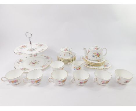 A Minton porcelain part tea service decorated in the Marlow pattern, comprising two tier cake stand, bread plate, teapot, pre