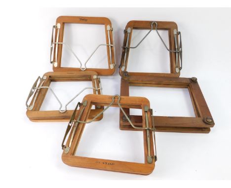 Four vintage Dunlop tennis racquet head presses, and a further head press. (5)