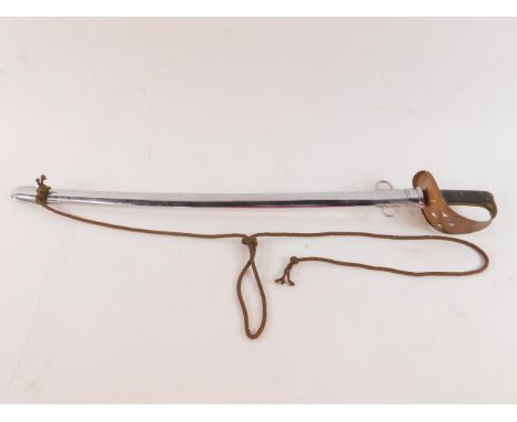 A WWI British Calvary sabre, bears marks to blade, grip and scabbard, blade 85cm long.