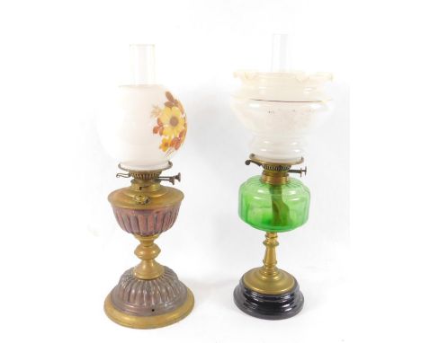 A Youngs's copper and brass oil lamp, glass chimney and globular white glass shade printed with flowers and leaves, 57cm high