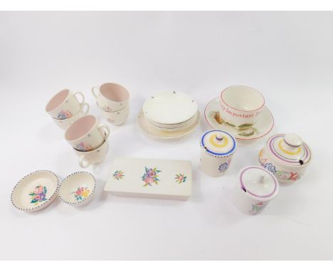 A group of Poole pottery traditionally decorated with flowers, including six cups and saucers, three preserve pots, and a box