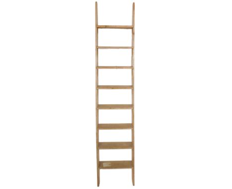 A pine step ladder, of eight rungs, 234cm H, 49cm W.
