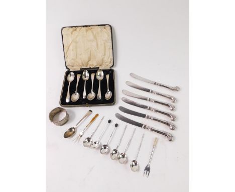 A set of six Edward VII silver pistol handled cake knives, Sheffield 1906, a Harlequin set of six silver teaspoons, cased, a 