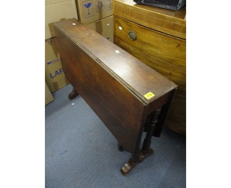 A Victorian mahogany Sutherland table having ring turned legs, 26 1/2 x 35 3/4