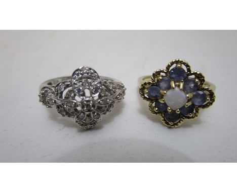 A 14k white gold and diamond cluster ring and a 9ct yellow gold opal and mauve coloured, stone set ring