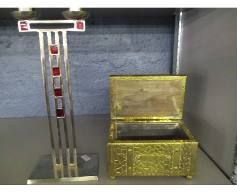 A brass tea caddy and an Arts & Crafts style candlestick