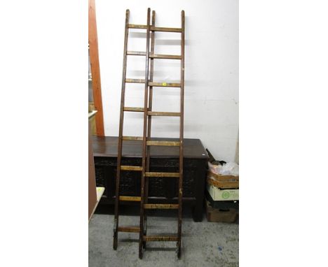 An early 20th century wooden, two section ladder, extending