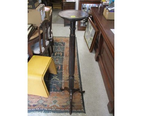 A 1920s mahogany torchere on a tripod stand, 52 h