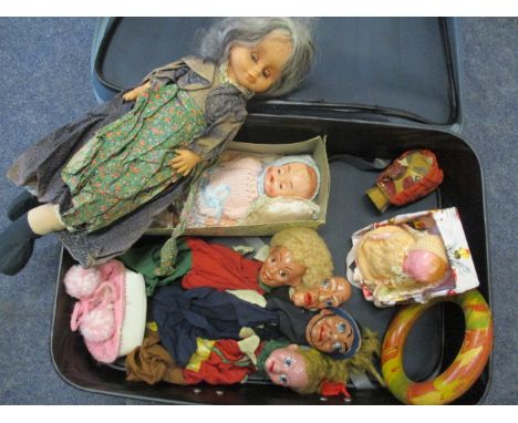 Four hand painted hand puppets, three retro dolls, a rubber ring and a carved Punch puppet head and a Rosebud Fairy doll 