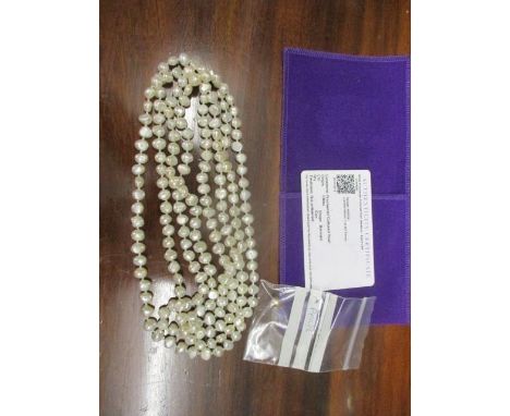 A string of freshwater cultured pearls and a single pearl 