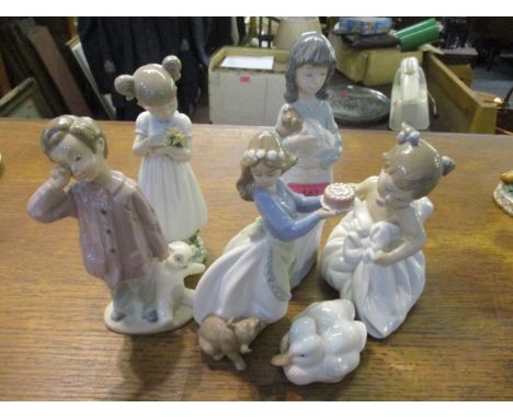 A Lladro figure of a girl holding flowers, together with four Nao figures and a Copenhagen ornament of two ducks 