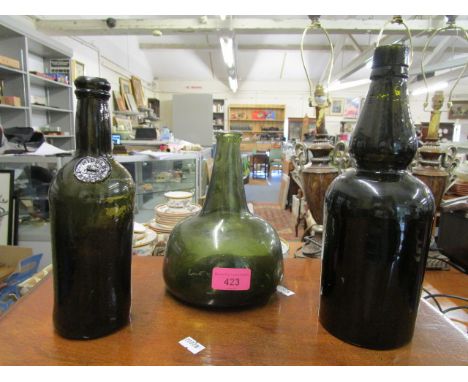 A Dutch 18th century Shalft and Globe wine bottle, a 19th century bottle with Middle Temple seal and one other bottle (3) 