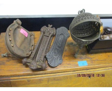 A mixed lot to include a horseshoe door knocker, two letter boxes and a mixture of hand coloured ornaments 