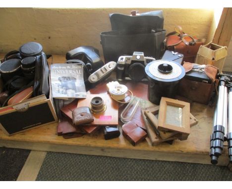 A vintage Johnsons Universal developing tank, box Brownie cameras, mixed lenses, a tripod, a Canonmatic and other cameras and