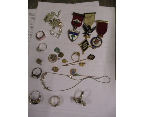 An assortment of mixed jewellery to include gold stick pins, silver chains, rings, Masonic medals and other items 
