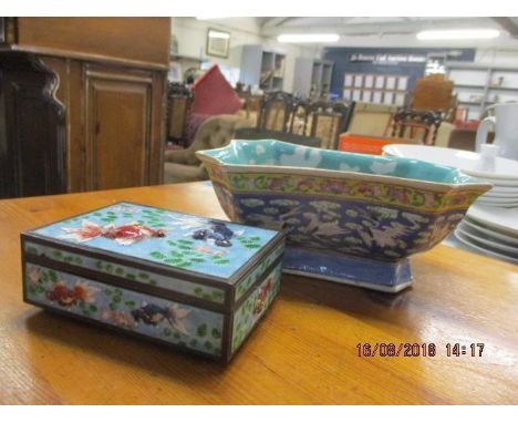 An early 20th century enamelled trinket box depicting carp on all sides and a 19th century Chinese flower bowl 