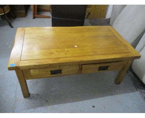 A modern light oak coffee table, 18"h x 43" 