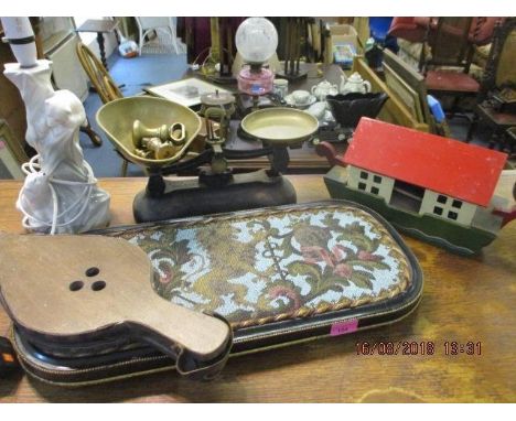 A mixed lot to include cast iron scales, a Noah's Ark, an ebonized framed tapestry tray depicting a lion and other items 