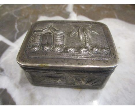 A small white metal Continental embossed trinket box 