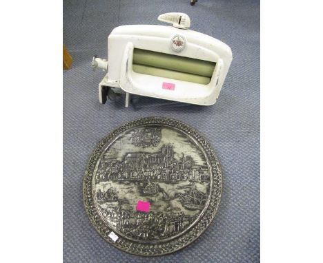 A vintage ACME mangle and a large circular tin 