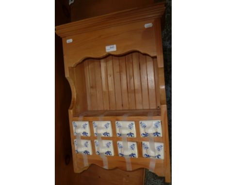 Pine wall shelf with ceramic spice drawers