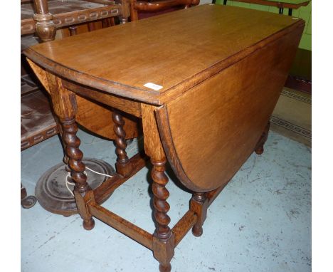 Oak drop leaf table on barley twist supports