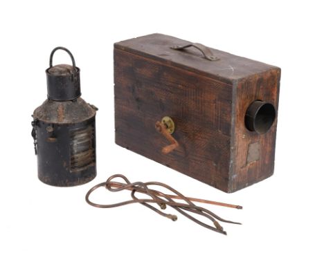 A ships navigation lamp and a Norwegian foghorn in wooden carrying case with crank handle.