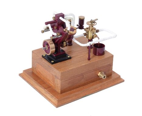   A well engineered model of a twin oscillating model boat engine, with disc flywheel and mounted on hardwood plinth with per