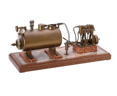   A well engineered model of a twin oscillating vertical steam engine, linked to a brass horizontal cross tube boiler with wa