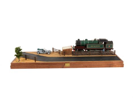   A model of a 2 1/2 inch gauge Great Central 4-6-2 side tank locomotive No 165. The model finished in dark green and black l