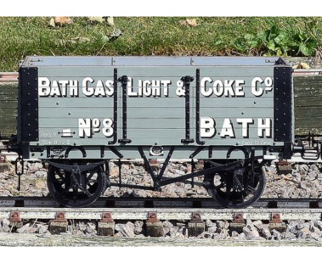 A 5 inch gauge private owners seven plank coal wagon built by Bath Wagon Works. 'The Bath Light and Coker Company Bath', pain