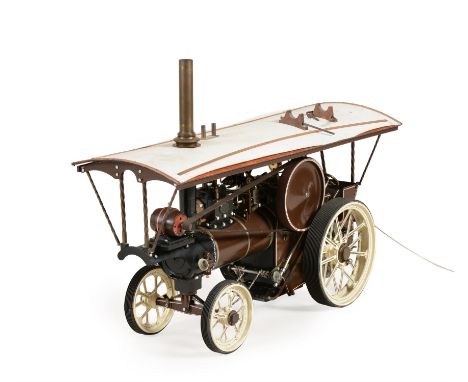 A model of a Maxwell Hemmens 1 inch scale live steam showman's tractor, the boiler with fitted water sight glass, steam press
