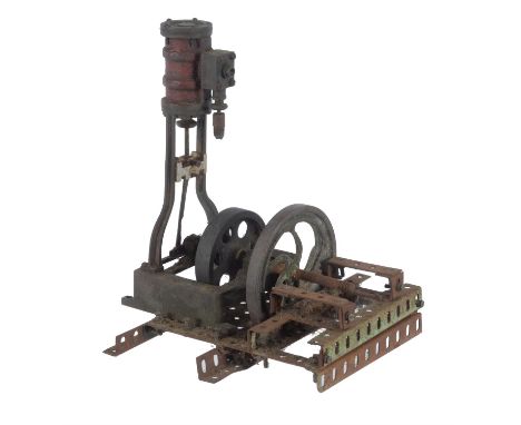   A vintage model of a vertical live steam engine, having single cylinder mounted on slipper guides with open crank and flywh