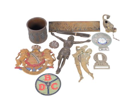 A group of various items, including a bronze Corpus Christi, safe plaque, brass oil lamp, erotic brass cigar cutter, etc 