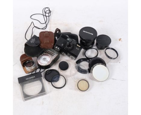 A Rollei B35 and lens, in associated case, and a selection of other Vintage camera equipment 
