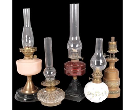 A group of 5 oil lamps, including 1 with cranberry glass font and chimney, H57.5cm, a brass lamp, etc 