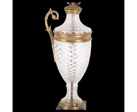An Empire style table lamp, diamond-cut glass body on a square brass base, with ormolu mounts (1 handle detached), H60cm 