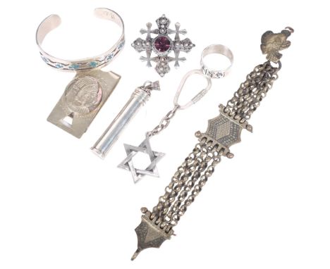 A group of silver jewellery, including a Mexican sterling silver money clip, and Israeli silver and amethyst set brooch, a St