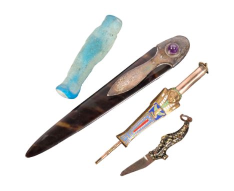 A brass and enamel propelling pencil, in form of an Egyptian sarcophagus, a miniature shoe design penknife, a tortoiseshell a
